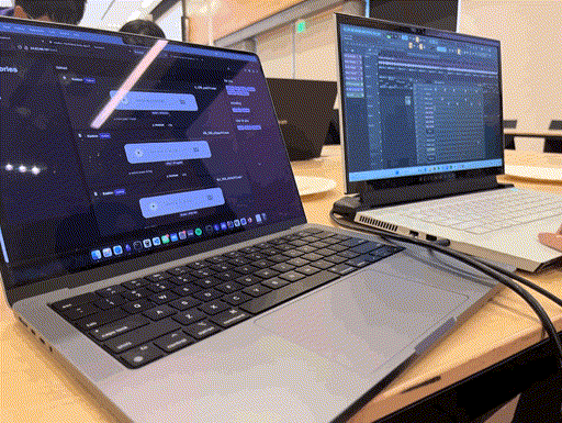 Two laptops, one displaying snippet.club